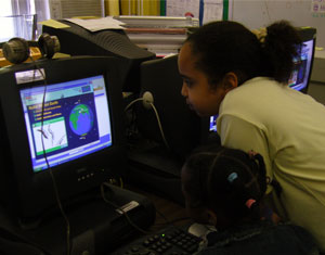 Student looking at a monitor screen.